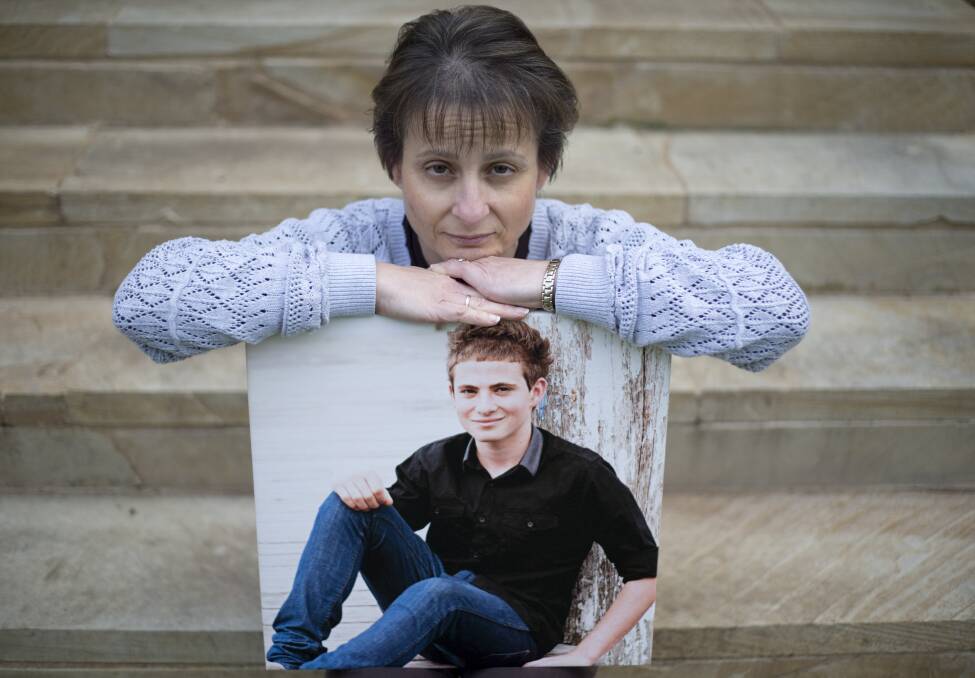 KEEP THEM SAFE: Colleen Vassallo with a picture of her late son Philip at her Berkshire Park home. Picture: Geoff Jones