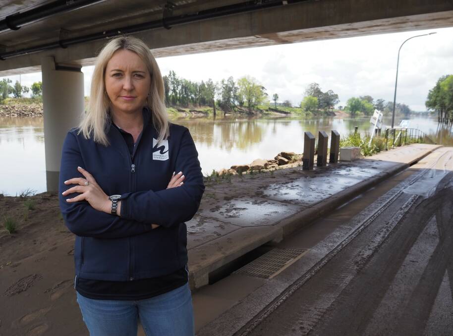 Hawkesbury mayor Sarah McMahon stands below Windsor Bridge, which was submerged by floodwaters from Hawkesbury River last week. Picture supplied.