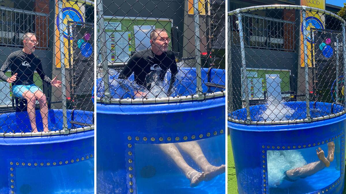 St Matthew's Primary School Windsor Principal Tim Vane-Tempest gets a dunking at the St Matthews Fun Day, hosted thanks to a NSW Government resilience grant. Pictures supplied