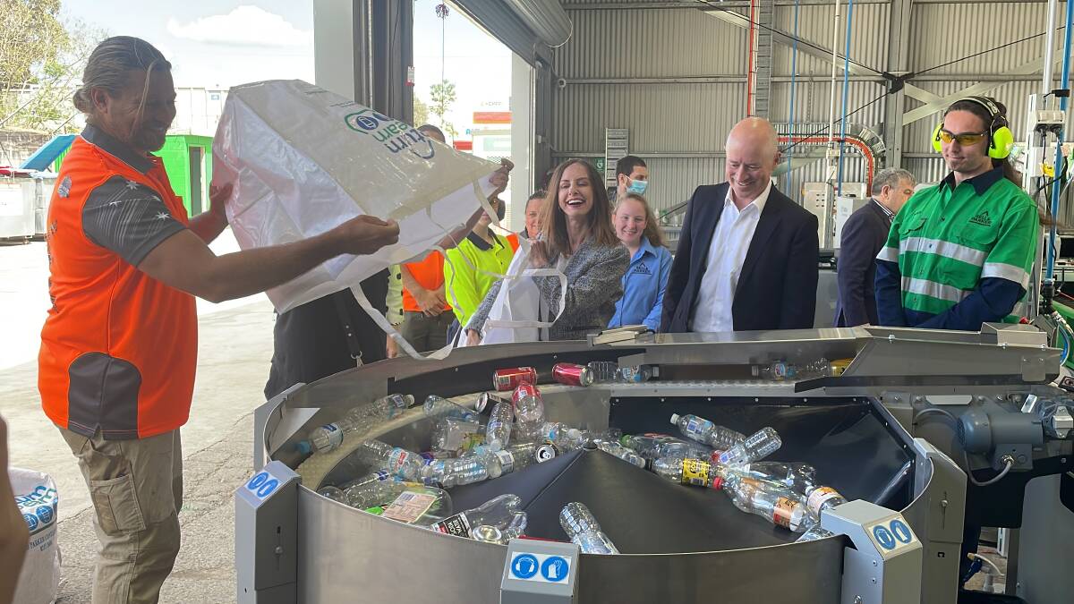 RuffTRACK's co-founder and manager, 'Farmer' Dave Graham and Hawkesbury MP Robyn Preston demonstrate the new bulk-drop Return and Earn depot at South Windsor. Picture by Sarah Falson