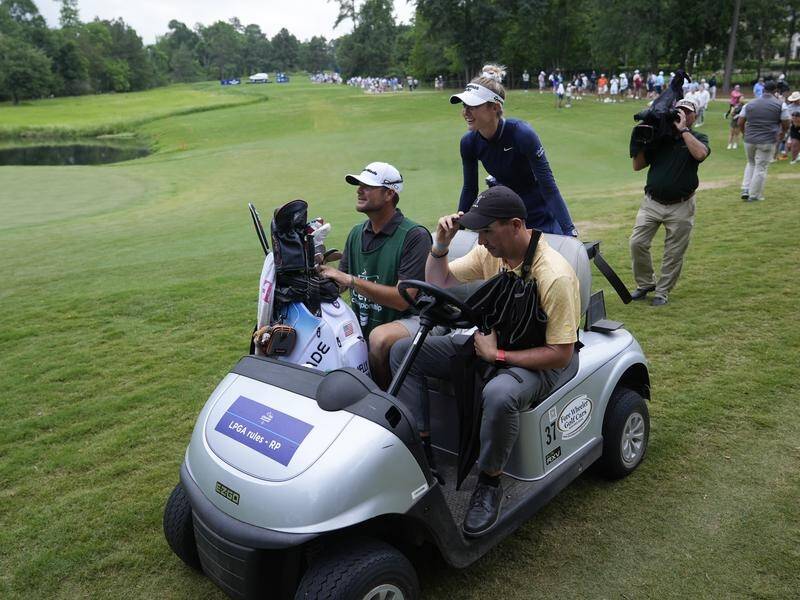 Nelly Korda is carted off the course after lighting halted play in the women's golf major in Texas. (AP PHOTO)