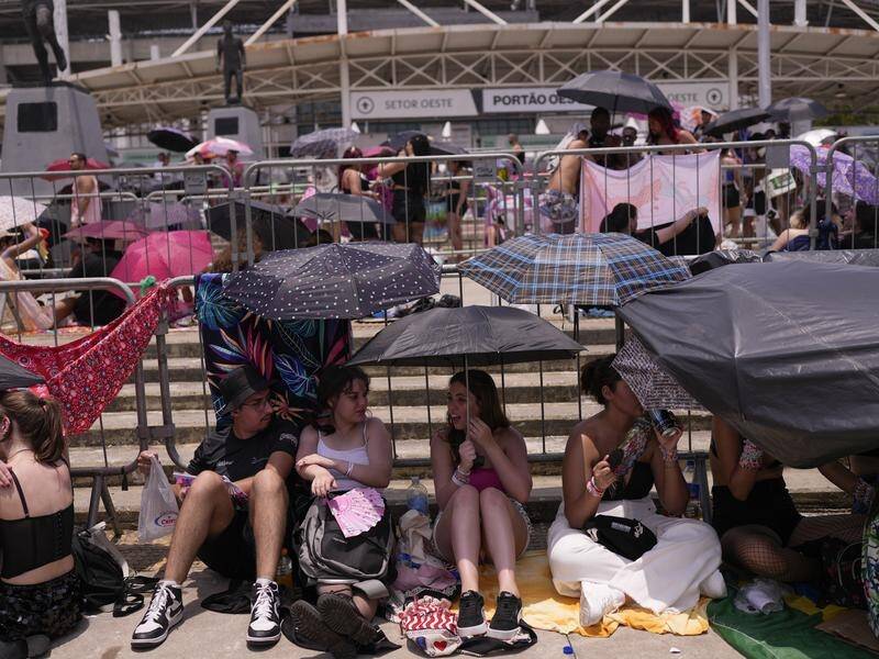 Fans waited in punishing temperatures for Taylor Swift's Eras concert in Rio de Janeiro. (AP PHOTO)